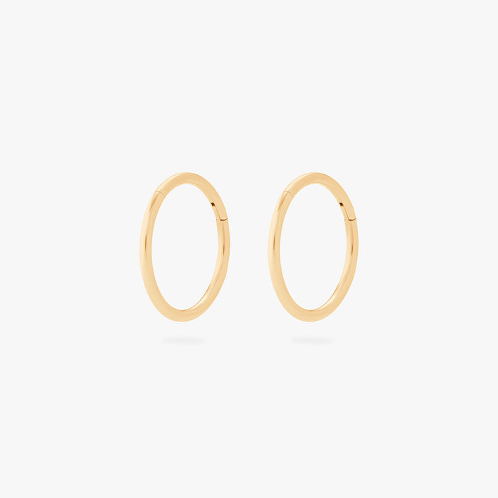This is an image of a pair of gold clickers with 10mm inner diameters. [pair] color:null|gold