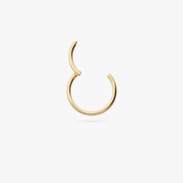 This is a gold clicker earring color:null|gold