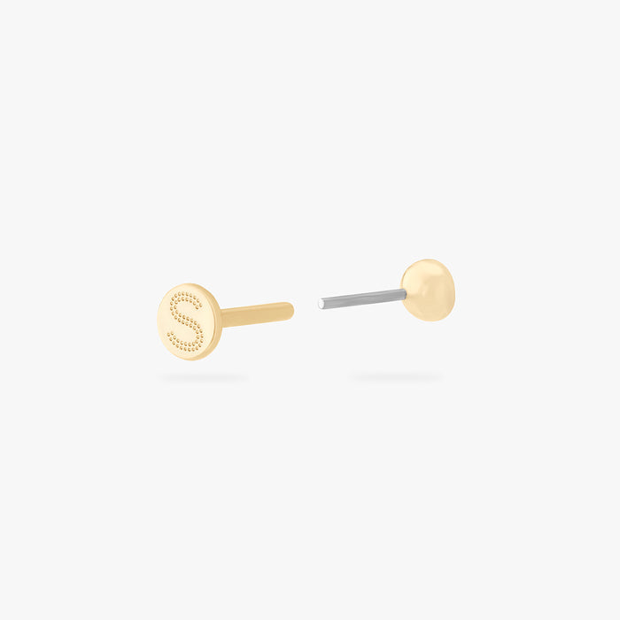 This is an image of a 14k gold flatback with a bezel setting and clear stone on ear. color:null|14k gold