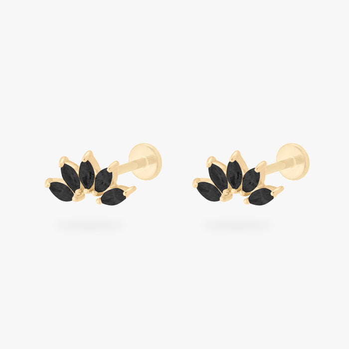 This is an image of a pair of 14k gold flatbacks with crown marquise cz settings and black cz stones.