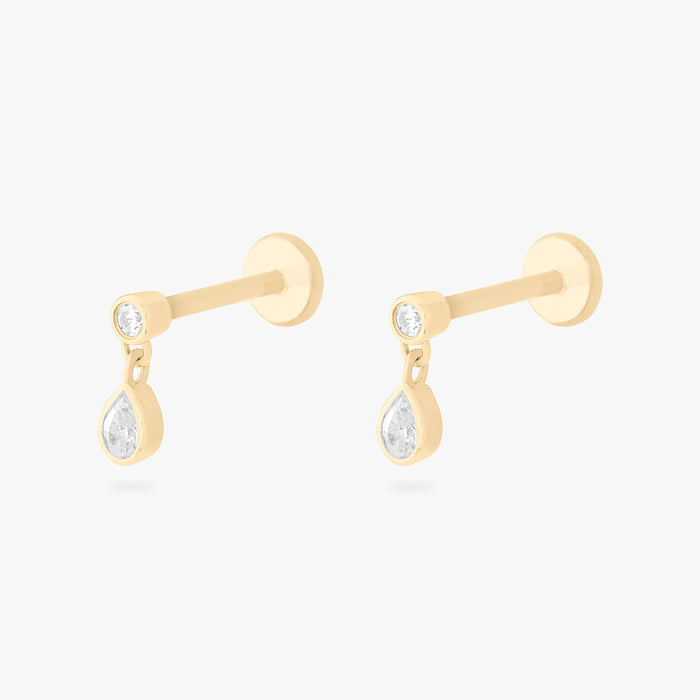 This is an image of a pair of 14k gold flatback studs with pear-shaped, bezel set clear cz stones dangling from other pear-shaped, bezel set clear cz stones.. [pair] color:null|14k gold/clear