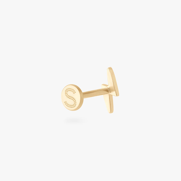 This is an image of a 14k gold flatback stud that is shaped like a lightning bolt.
