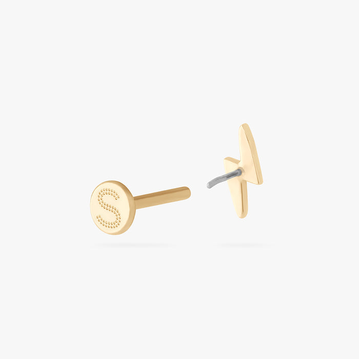 This is an image of a 14k gold flatback stud that is shaped like a lightning bolt