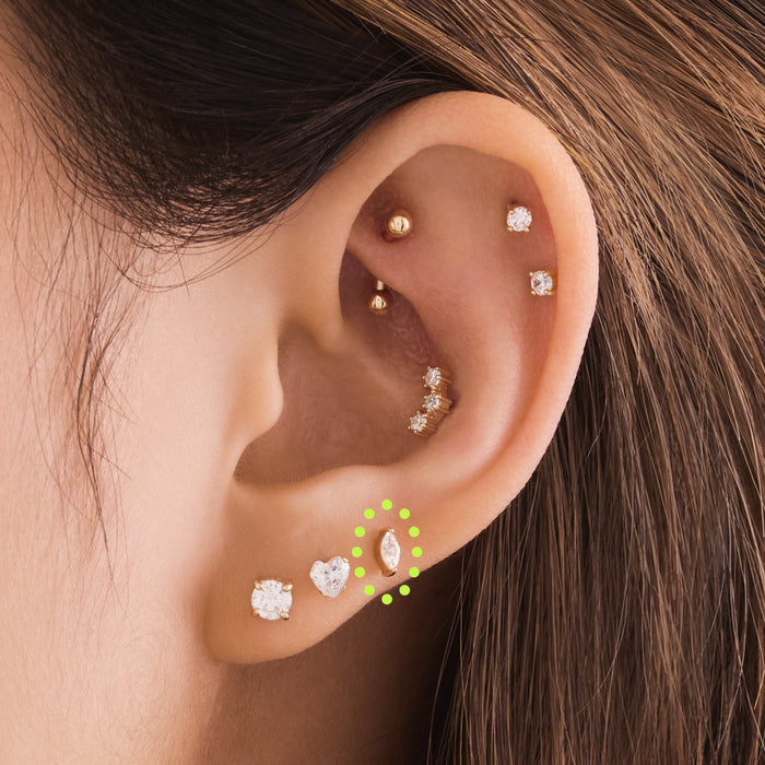 This is an image of a 14k gold flatback with a marquise setting and clear stone on ear. [hover] color:null|14k gold/clear