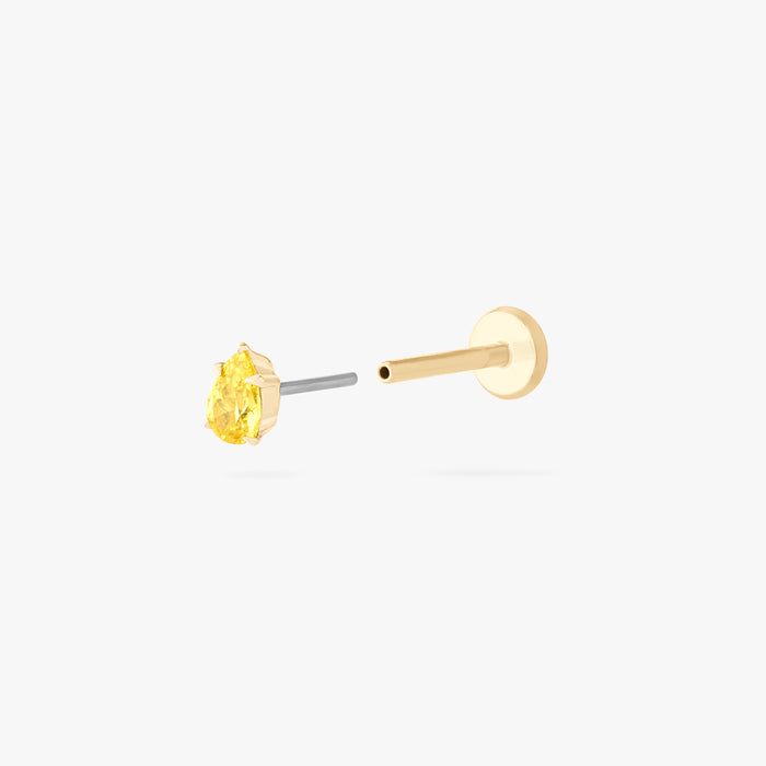 This is an image of a 14K gold flatback stud with a pear shaped topaz cz stone against a white background. This image shows the flatback stud pieces separated.