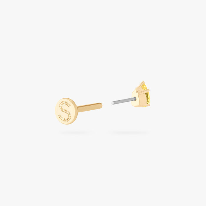 This is an image of a 14K gold flatback stud with a pear shaped topaz cz stone against a white background. This image shows the flatback stud pieces separated, and focuses on the Studs "S" on the flatback post.