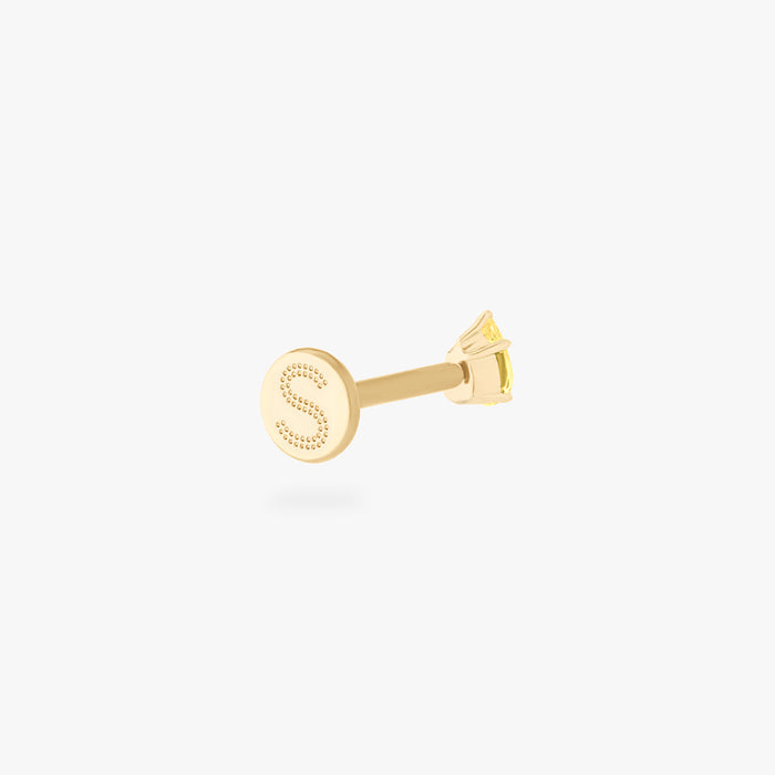 This is an image of a 14K gold flatback stud with a pear shaped topaz cz stone against a white background. This image shows the flatback stud facing away from the camera, and focuses on the Studs "S" on the flatback post.