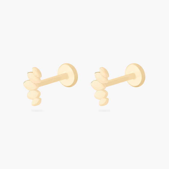 This is an image of a pair of 14k gold flatback studs that are solid gold crown marquise shaped.