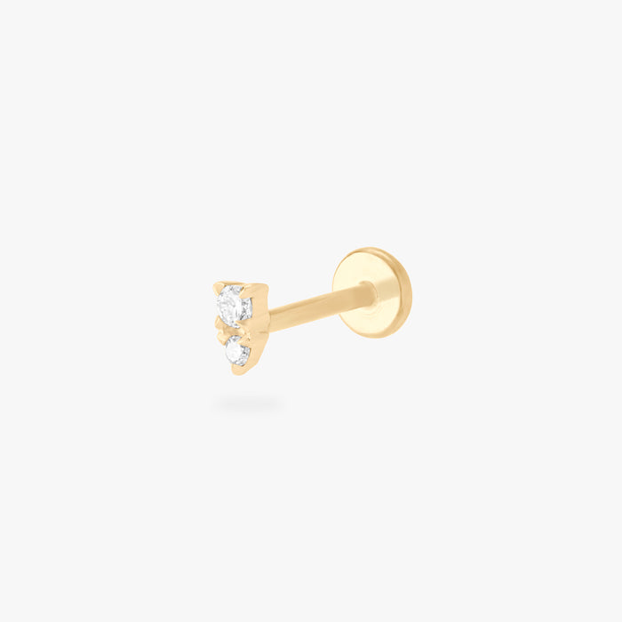 This is an image of a gold flatback stud with a clear stacked cz stone.