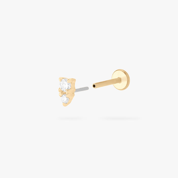 This is an image of a gold flatback stud with a clear stacked cz stone.