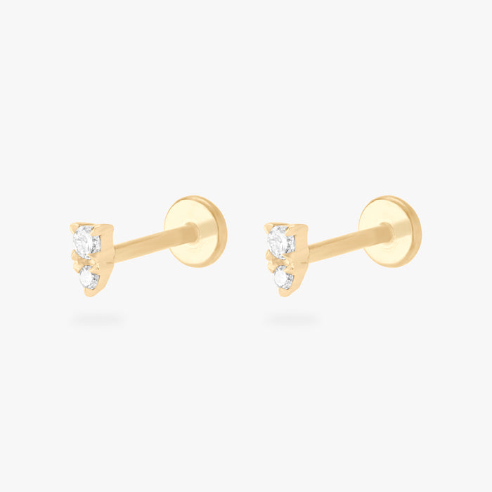 This is an image of a pair of gold flatback studs with clear stacked cz stones.