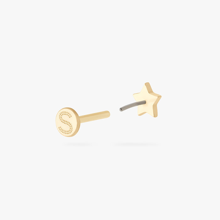 This is an image of a 14K gold flatback stud that is in the shape of a star.