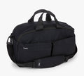 Black duffel bag with shoulder strap, front zip pockets, and 'Pakt.' logo.