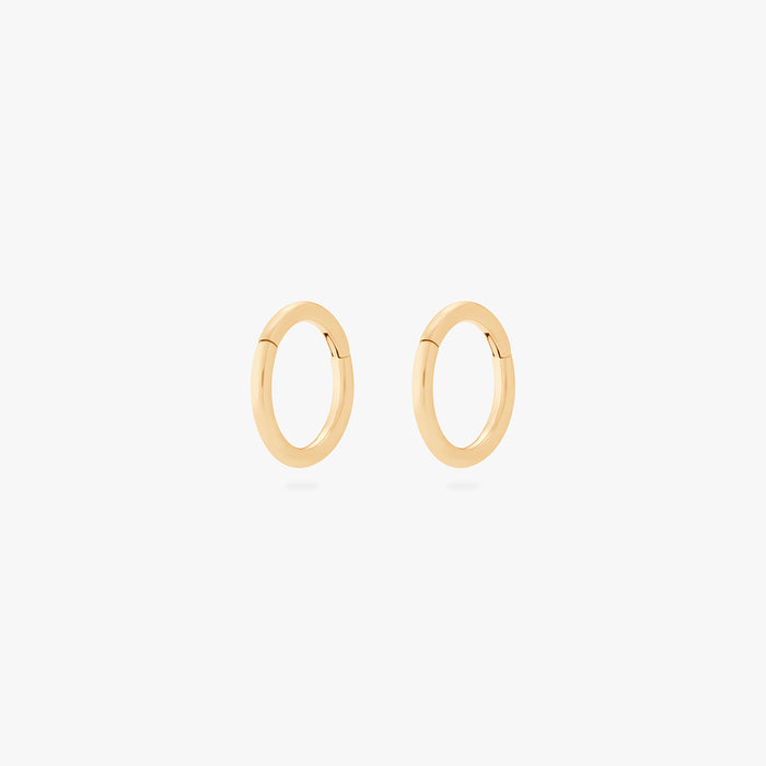 This is an image of a pair of gold clickers with 6mm inner diameters. [pair] color:null|gold