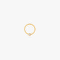 This image shows a 14k gold plated titanium front face clicker with a clear cz