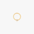 this image shows a 14k gold plated titanium front face clicker with a clear cz