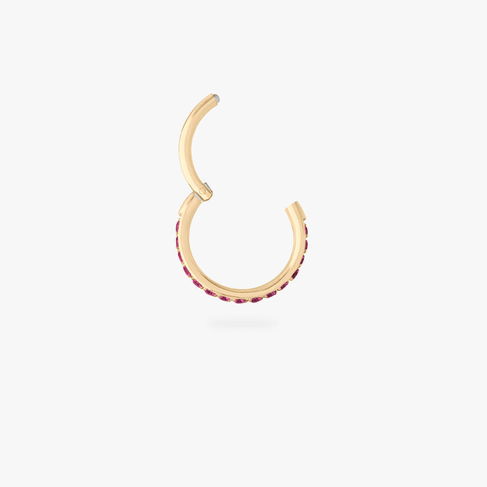 This is a gold toned clicker with garnet cz stones. color:null|garnet