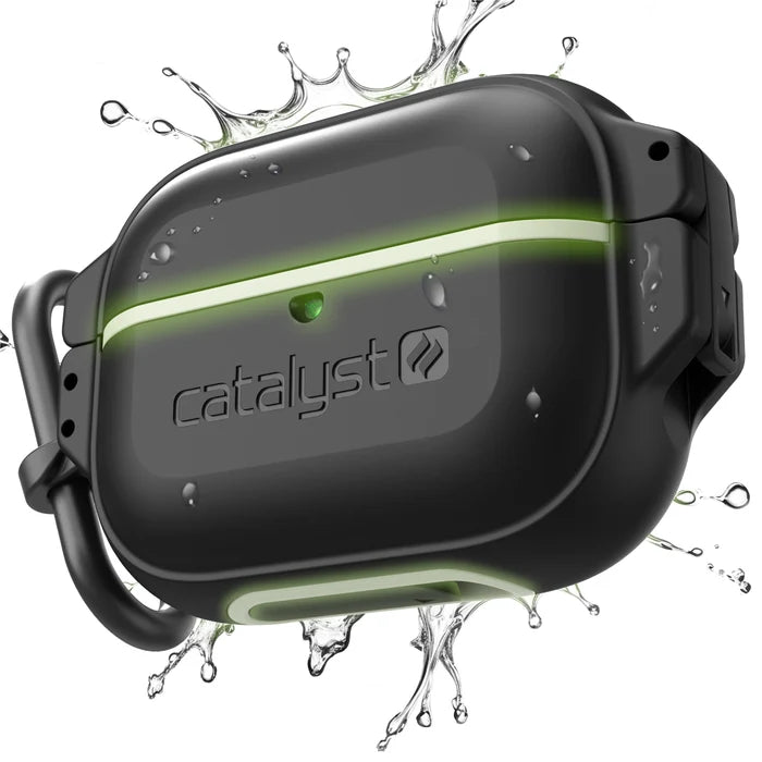 The Catalyst Case US AirPods Pro (Gen 2/1) 100M Waterproof Total Protection Case in Black - Glow in the Dark is shown with water splashes, featuring rugged design, visible branding, a latch, and a carabiner clip on the left side.