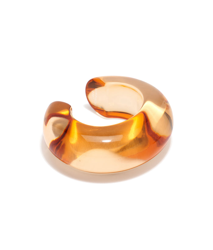 Arc Cuff in Marigold. Domed cuff bracelet in transparent, orange-yellow resin.