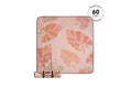 Recycled picnic blanket with autumn leaf print in coral and orange tones, shown rolled with carrying strap