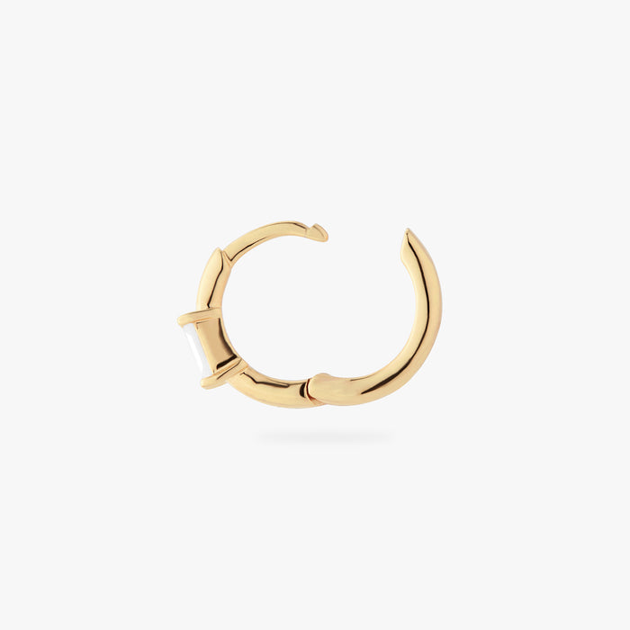 a gold small slim huggie with a clear baguette cz color:null|gold/clear
