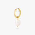 This is a dangling pearl huggie. color:null|gold