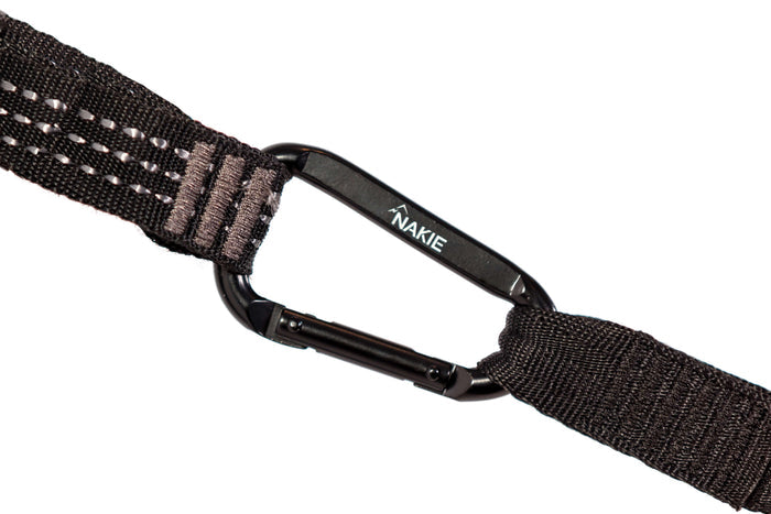 Black nylon camera strap with reflective stitching and Nakie-branded carabiner clip