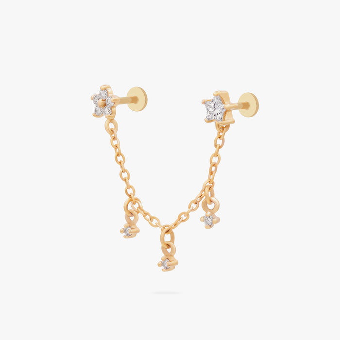 This is an anodized gold titanium chained flatback stud with two flatback posts. Each flatback stud is a clear star CZ, and there is a chain with three clear CZ stones that connect the two earrings.