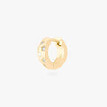 This image displays a 14K gold plated chunky huggie that features twinkle star shaped engravings with crystal CZ stones throughout the huggie against a white background.
