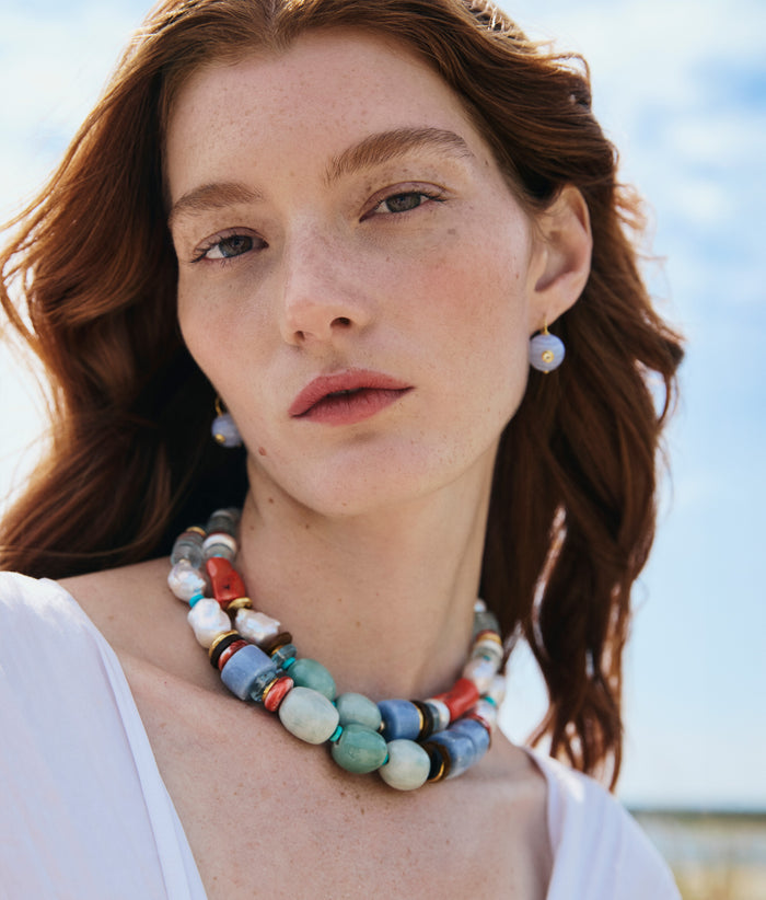 Model wearing Ariel Necklace in Cosmos and Comet Earrings in Blue Agate.