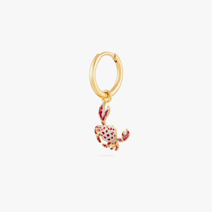 This image shows a 14k gold plated huggie earring with a crab charm with red spots.