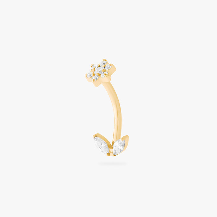 This is an image of a gold-toned titanium curved barbell with crystal CZs in the shape of a flower on one end of the bar, and crystal CZs in the shape of leaves on the other end of the bar.