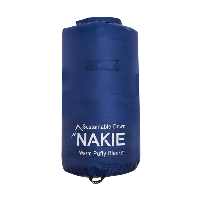 Studio shot of Nakie's Deep Ocean Blue Sustainable Down Puffy Blanket in its unopened packaging