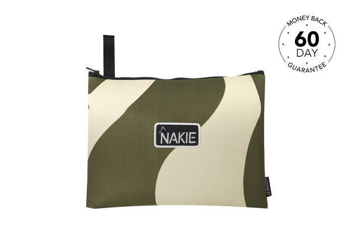 Eucalyptus green and cream curved striped recycled beach towel with black carry handle and NAKIE brand label