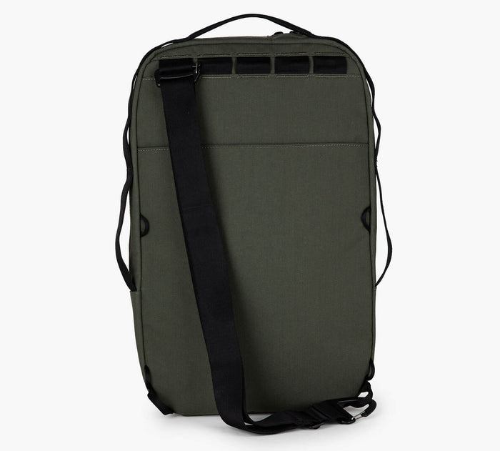 Rear of Everyday 15L bag with single sling strap, top handle, and daisy-chain loops on white background