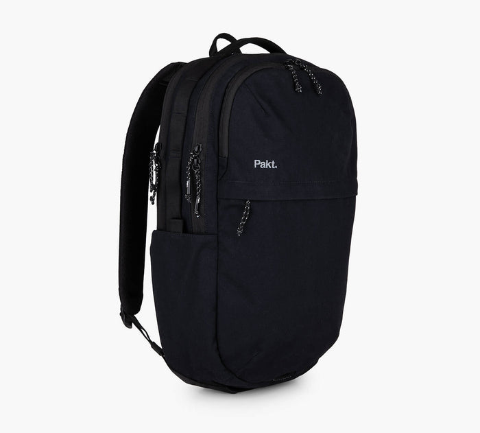Black Pakt. backpack with two zip compartments, side pocket, and padded shoulder straps