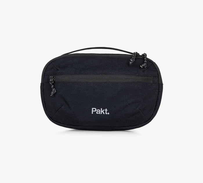 Black Pakt. travel pouch with top handle and front zip pocket