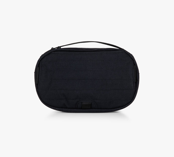 Small black oval zippered travel pouch with top carry handle