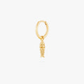 This image shows a 14k gold plated huggie with a dangling fish charm