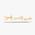 Set of 3 gold flatback earrings that comes with a reversible cat, a pave x, a mini cz, and a flatback insertion tool