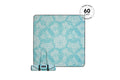 Turquoise and cream floral patterned picnic blanket rolled with carrying straps
