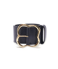 Florence Belt in Black and Gold. Thick black leather belt with clover-shaped gold buckle.