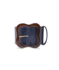 Florence Belt in Navy/Brown. Navy blue leather with brown resin 'clover' buckle.