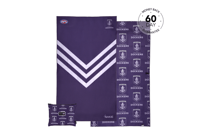 Purple Fremantle Dockers beach towel with white chevron stripe and anchor logo pattern, displayed flat with matching pillowca
