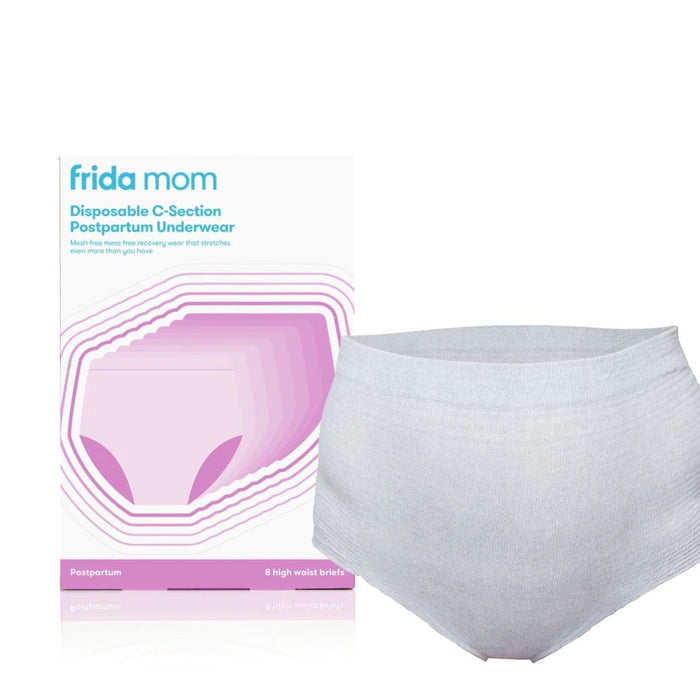 Packaging and a pair of high-waist disposable C-section postpartum underwear by Frida Mom, predominantly white with pink accents.