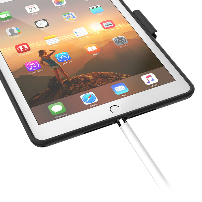 A close-up of an iPad (Gen 6/5), 9.7" in a Catalyst Case US Impact Protection Case shows app icons and a mountain wallpaper. An Apple Pencil is plugged in, and the home button is visible for easy access.