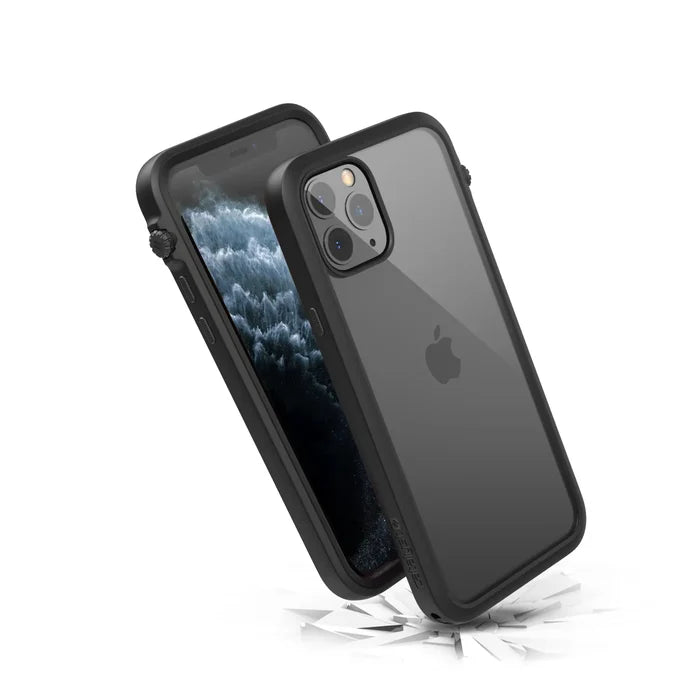 Two iPhone 11 Pros in black Catalyst Case US Impact Protection Cases are shownÃƒÂ¢Ã¢â€šÂ¬Ã¢â‚¬Âone displays the screen, the other the Apple logo and triple cameraÃƒÂ¢Ã¢â€šÂ¬Ã¢â‚¬Âbouncing off shattered white surface, highlighting MIL-STD 810G drop-proof protection.
