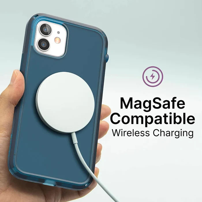 A hand holds an iPhone 12 / 12 Pro in a blue Catalyst Case US Influence Case, with a circular MagSafe charger attached. The text says “MagSafe Compatible Wireless Charging” with a charging icon above it on a light background.