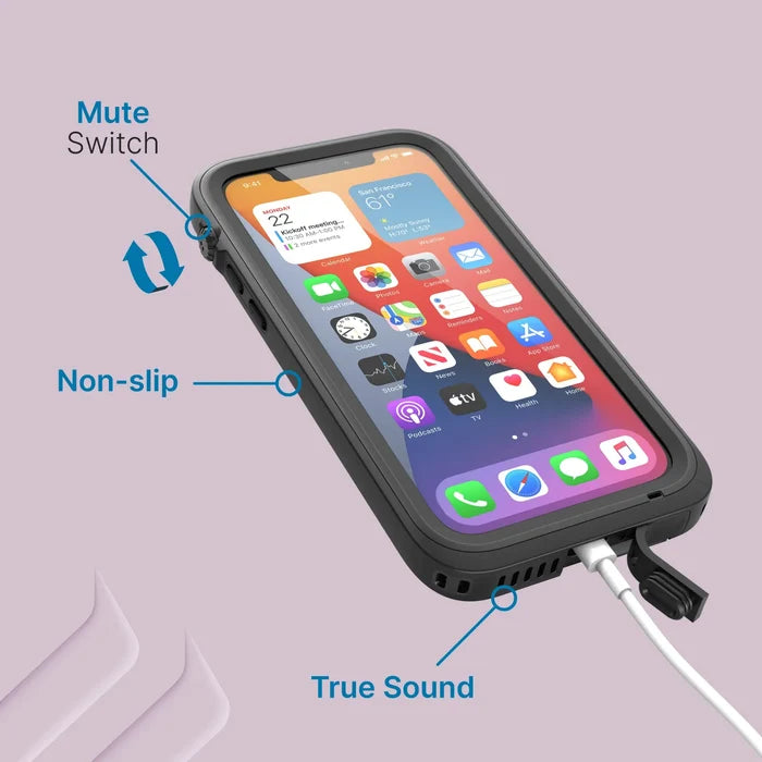 The iPhone 12 Pro in a Catalyst Case US Total Protection waterproof case is shown on a lavender background, with blue labels highlighting the mute switch, non-slip grip, and True Sound near the white charging cable. App icons appear on its screen.