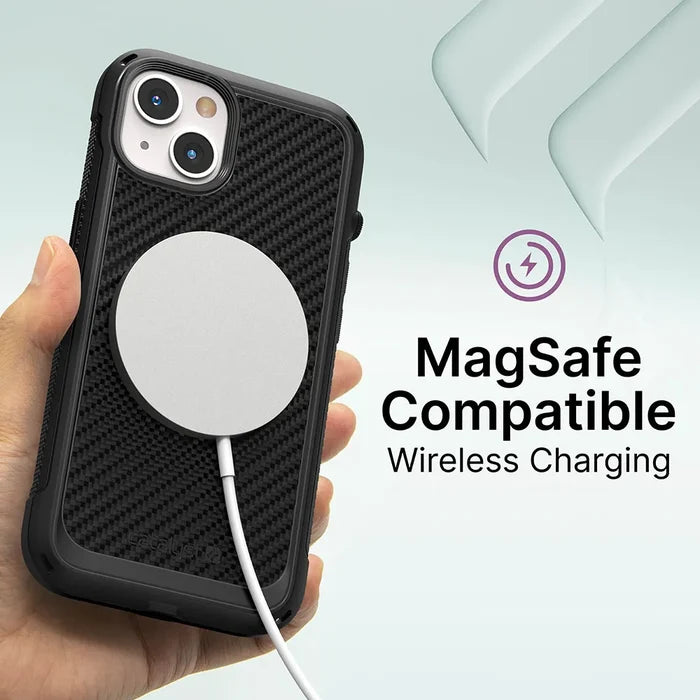 A hand holds an iPhone 13 mini in a black Catalyst Case US Vibe Case. A MagSafe wireless charger with a white cable is attached to the back. Text: “MagSafe Compatible Wireless Charging.”.